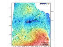 A multibeam map of the seafloor shows deep depressions, or pockmarks, in dark blue.