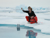 Mette Nielson lowers a baited amphipod trap into Arctic waters.