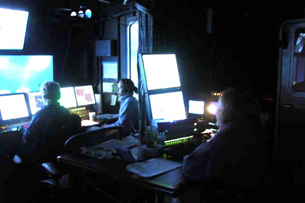 In the control van, Sarah L'Heureux of the Woods Hole Oceanographic Institution performs her data logger duties