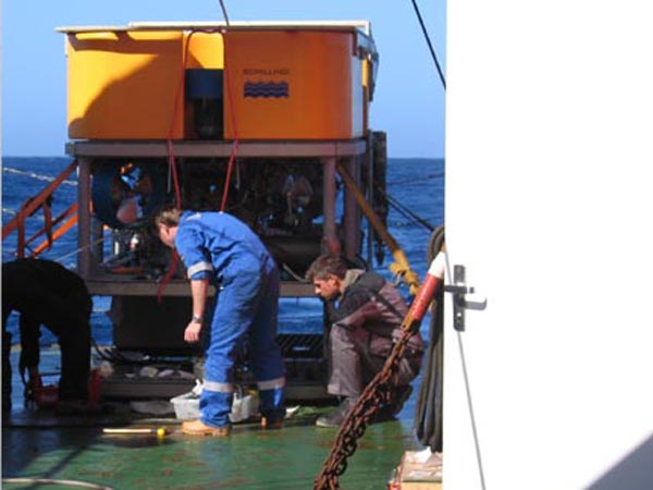 Engineers attending to the Kiel 6000-meter remotely operated vehicle under the massive A-frame on the stern of the R/V SONNE.