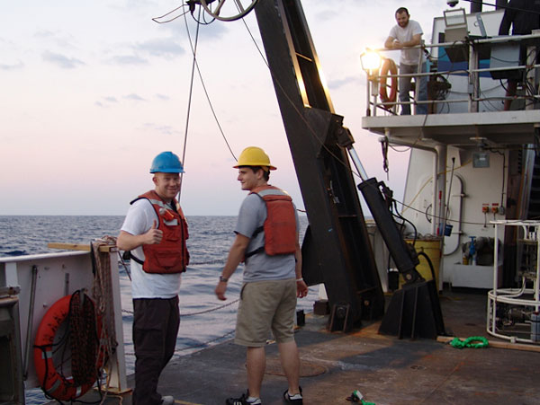 Matt and Jay prepare to help recovery the remotely operated vehicle (under the watchful eye of chief scientist Erik Cordes). 