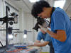 Santiago Herrera photographs a coral specimen.