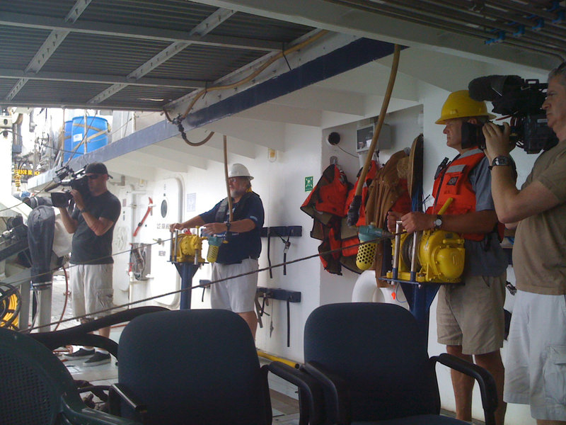 Cameramen from CNN and BBC film conductivity, temperature, depth (CTD) sampling operations. Part of the mission’s outreach efforts include sharing visual accounts of science activities with the public.