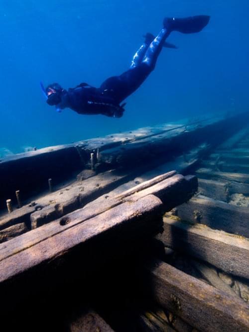 Shallow-water shipwrecks dot the shoreline of Thunder Bay, providing recreational opportunities for snorkeling, diving, and kayaking. Shown here are the remains of both the 1840s sidewheel steamer New Orleans (top photo), one of the oldest known wrecks in the sanctuary, and the schooner American Union.