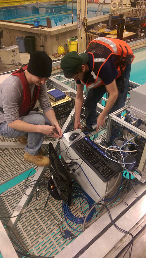 Myles and Devon on the tow carriage setting up the experiment.