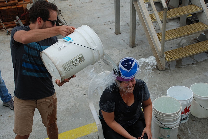 Per tradition, Caitlin is “rewarded” with an ice bath and handcrafted costume following her first time in Alvin.