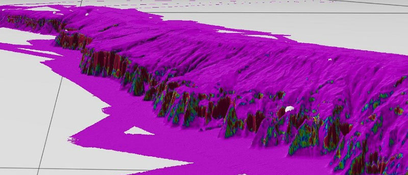 Multibeam map showing miles of the rugged West Florida Escarpment. The red and green areas are steep slopes, which are likely to support deep-sea corals.