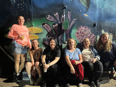 Some of the science crew and a mural depicting marine sponges in Ponce, Puerto Rico.