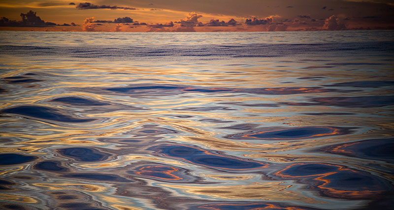 The water is so calm, it is hard to believe that the nearest land is more than 400 nautical miles away; it looks more like a painting than reality.