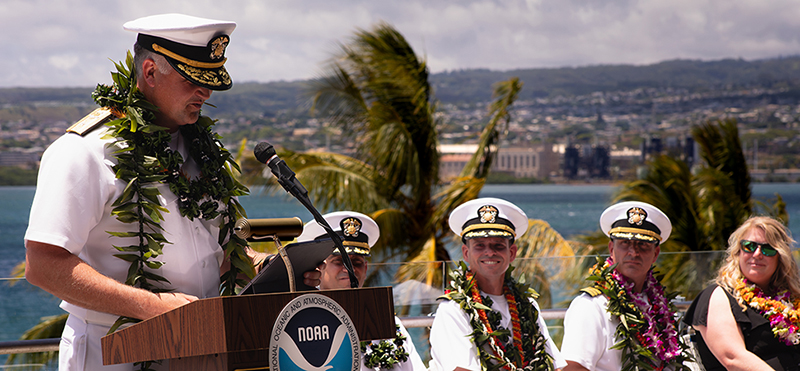 Deputy Director of the NOAA Commissioned Officer Corps and NOAA Marine and Aviation Operations Rear Admiral Chad Cary addresses the audience during the ceremony signaling the change of command of NOAA Ship Okeanos Explorer.