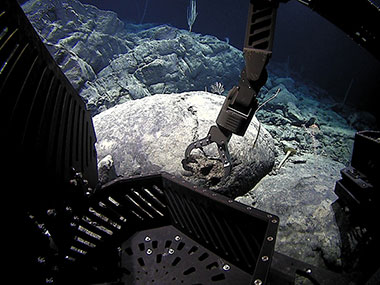 D2 collects a rock on an unnamed seamount 180 nautical miles south of Midway Island.