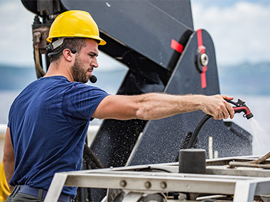 Remotely operated vehicle engineer Sean Kennison washes down Seirios after our launch and recovery practice.