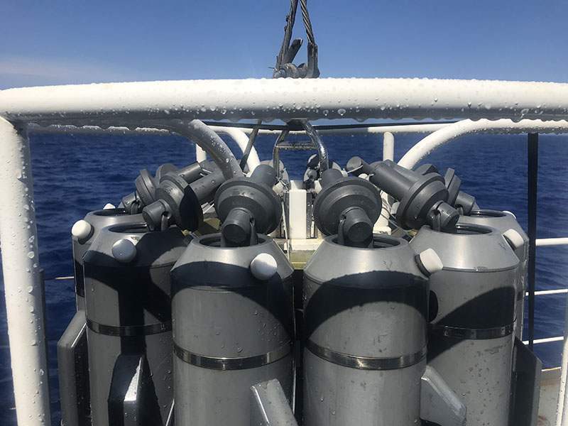 A closer look at the latch system that holds the Niskin lids together. The top Niskin bottle lid is also connected to the bottom lid via rubber tubing, creating tension inside the bottle that will ensure both lids close simultaneously.