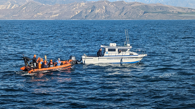 After a week-long stay on NOAA Ship Okeanos Explorer, Mia and Keli Lopez are transferred to Channel Islands National Marine Sanctuary’s Research Vessel Minke to be shuttled back to land.